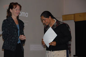 USAID/Nepal Mission Director Beth Paige presents trainee certificate